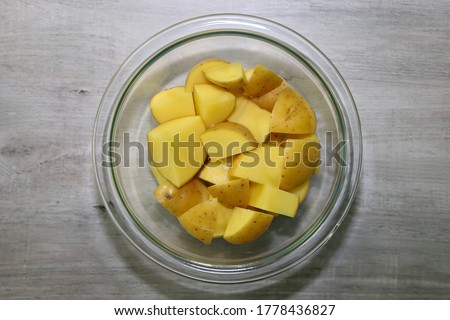 Top view of yukon gold potatoes cut in chunks to use in recipe.