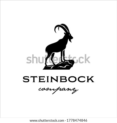 The Alpine ibex stands on a rock in a classic style design Royalty-Free Stock Photo #1778474846