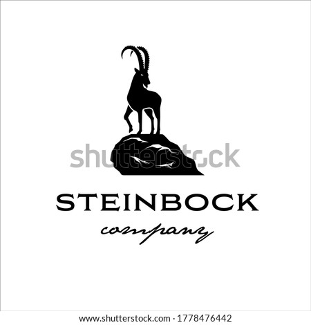 The Alpine ibex stands on the edge of a cliff in a classic style design Royalty-Free Stock Photo #1778476442