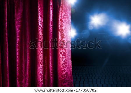 Theater curtain with dramatic lighting and lens flare