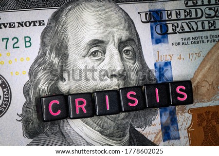 portrait of Benjamin Franklin from a hundred-dollar bill with a closed mouth and the caption title CRISIS. global financial economic crisis because of the covid-19 coronavirus pandemic