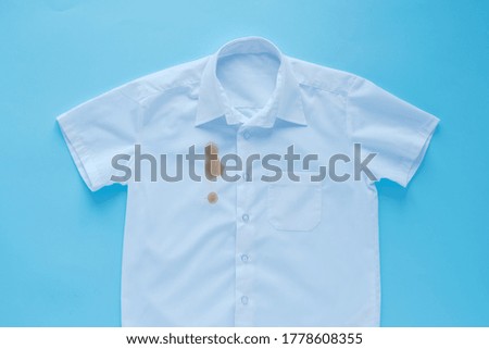 Stains from soy sauce on a white shirt Royalty-Free Stock Photo #1778608355