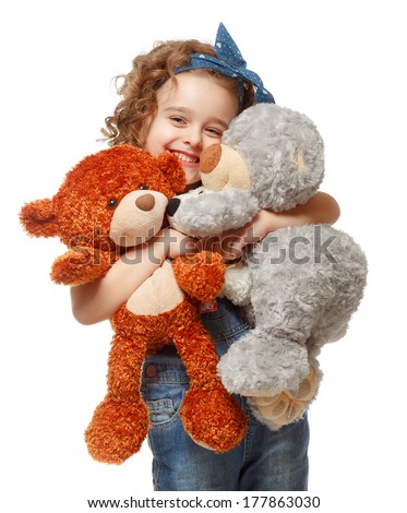 Little girl holding a teddy bear. Isolated on white background. Girl hugging two teddybears. Happy child. Royalty-Free Stock Photo #177863030