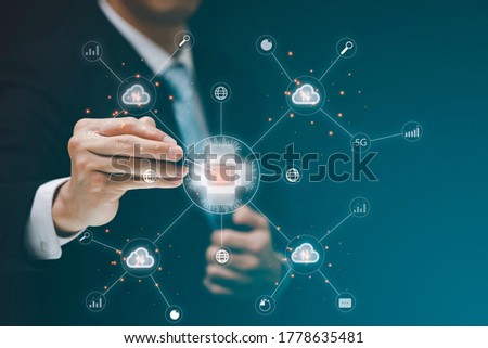Businessman Touching in graph Screen Icon and line connect to people icon of a media screen, Technology Process System Business concept.