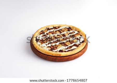 Special pizza, Sweet pizza with chocolate & halvah on wooden board