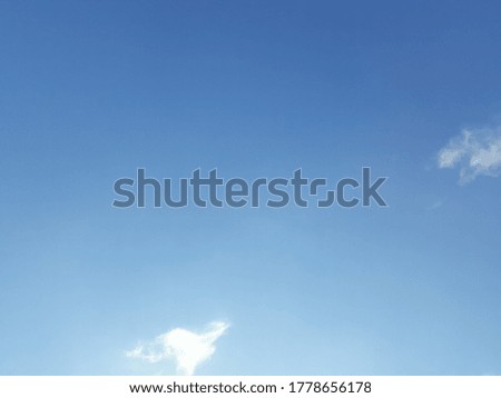 A thin cloud in the blue sky by day,  the sky is full of clouds, during the day, it looks bright, the wind forms like white cotton, beautiful above the sky, sun white, storm, sun, sunlight, white, at 