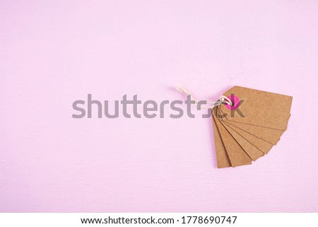 Blank label tag isolated on pink background. Price tag. Sale concept.