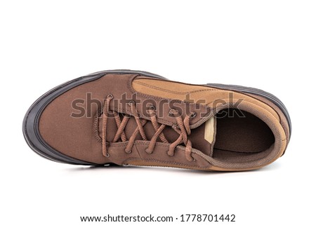 right cheap brown hiking or hunting shoe isolated on white background