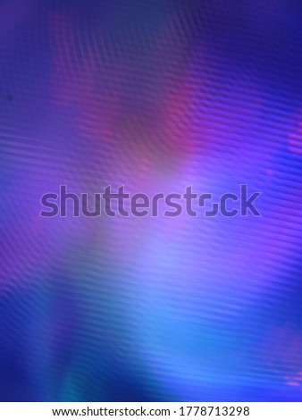 A mottled rotating abstract background with colorful light beams