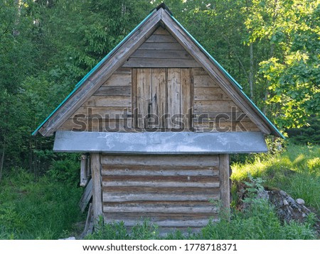 Wooden shed in the forest