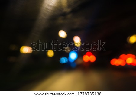 Long exposure neon lights on the black background. Freezelight. Lens flare. City lights, abstract blurred. Street in city at night. Beautiful pattern