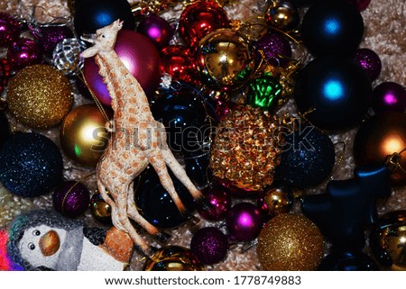 Christmas decorations: balls, giraffe, penguin