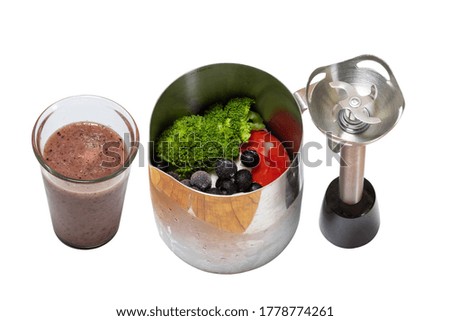 Ingredients and result of healthy juice made of tomato, broccoli, cabbage, yogurt and blueberries isolated on white background