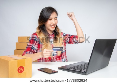 Asian women are starting a new business in the online market. Asian women checking products, preparing to deliver products to customers. SME Concept