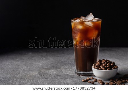 cold iced coffee on a dark background coffee beans, summer drink Royalty-Free Stock Photo #1778832734