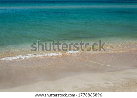 waves of beach, azure sea and white sand