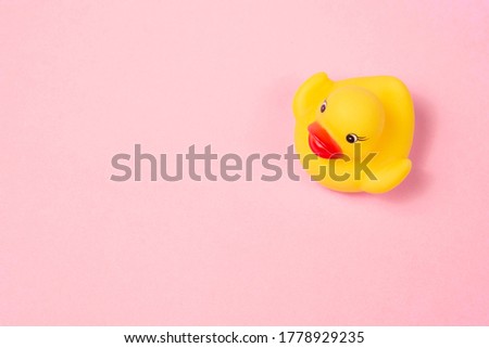 Rubber duck on the pink background.