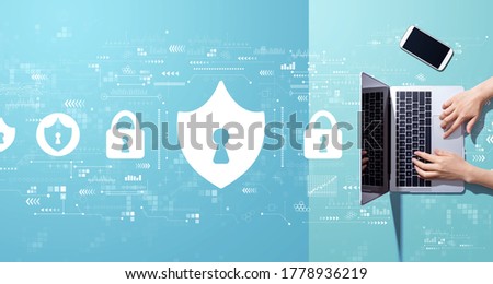 Cyber security theme with person working with a laptop