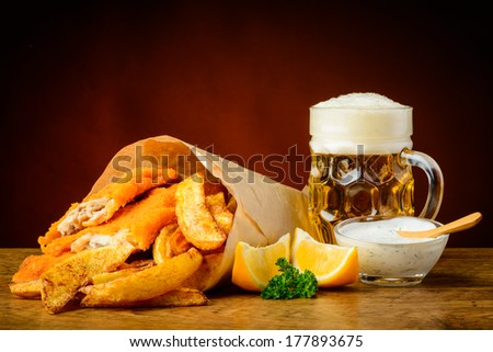 still life with traditional homemade fish, chips and beer Royalty-Free Stock Photo #177893675
