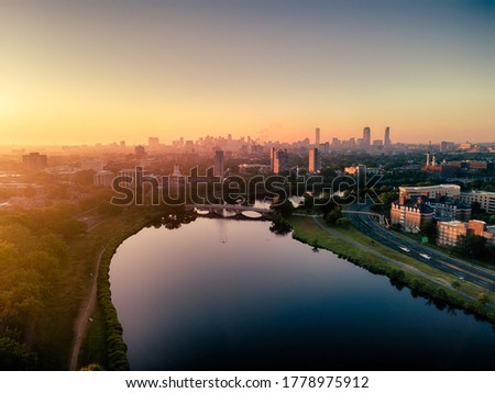 Aerial photo taken on Charles river at Cambridge, Boston city skyline under sunrise. 