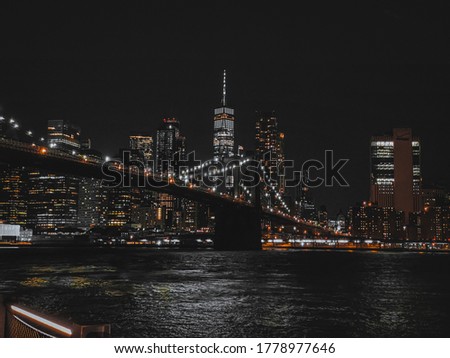 View of the New York City skyline and iconic Brooklyn Bridge at night!