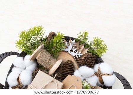 Zero waste Christmas concept. Wicker basket Hand crafted gifts with natural Christmas decorations without plastic. Flat lay, top view