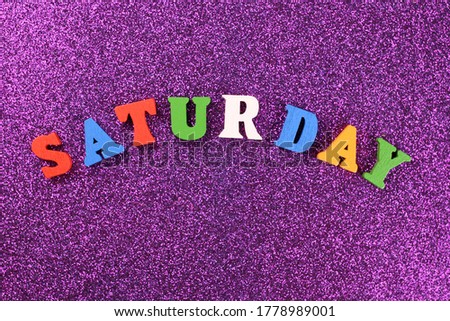 Saturday word made up of bright colored letter