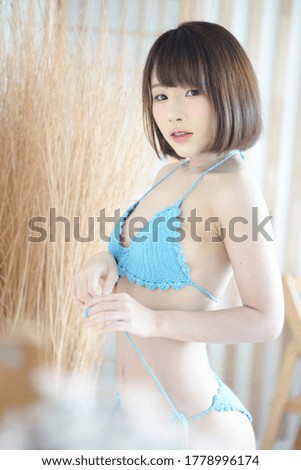 Portrait of an Asian woman in bikini