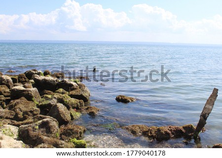 A mesmerizing shot of a seascape with the rocky shore