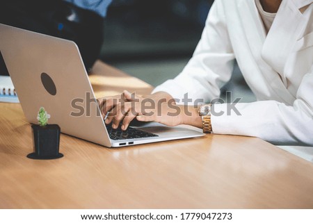 Young businesswoman using laptop lcomputer