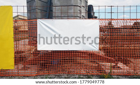 white pvc banner hanging outside construction site outdoor advertising space mockup