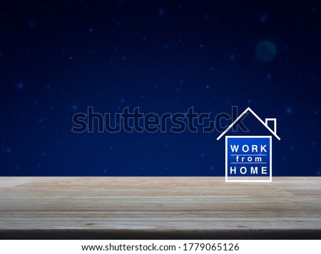 Work from home flat icon on wooden table over fantasy night sky and moon, Business social distancing online concept