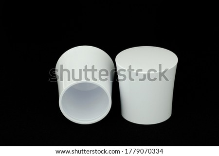 White plastic parts, black background From plastic injection products in the factory