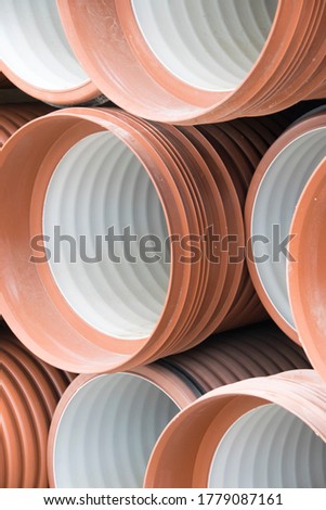 The warehouse of industrial plastic pipes and large diameter hoses. Products from plastic. Drainage and sewerage. Modern technologies of building houses and ennobling the territory. Urban network.
