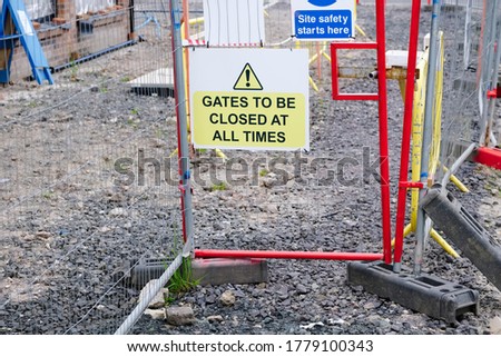 Gate must be locked at all times security sign at construction site