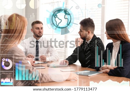 Business people having meeting in conference room and world globe. Modern technology
