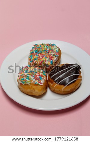 Donut mini or Mini donuts with mesis and chocolate topping, it tastes delicious,soft focus,shiny