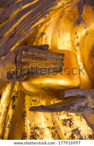 Golden ancient statue of Buddha.