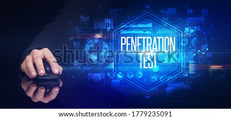 hand holding wireless peripheral with PENETRATION TEST inscription, cyber security concept