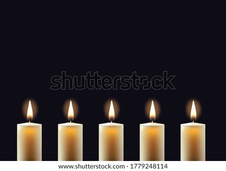 Candle flame on black empty background