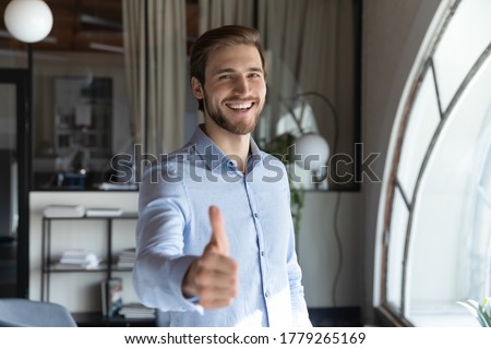 Portrait of smiling male caucasian customer or client show thumb up give recommendation to course or training, happy satisfied man recommend good quality company service, acknowledgement concept Royalty-Free Stock Photo #1779265169