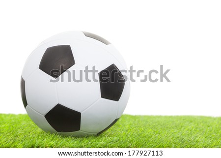 soccer ball on green grass isolated on white