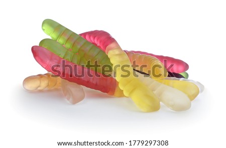 Heap of multi-colored candy worms isolated on white.