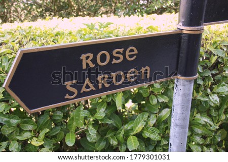 a note sign to the rose garden