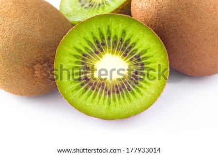 whole and half kiwi fruit on white background