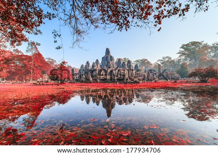 Bayon Castle, Cambodia. With red leaf tree Royalty-Free Stock Photo #177934706