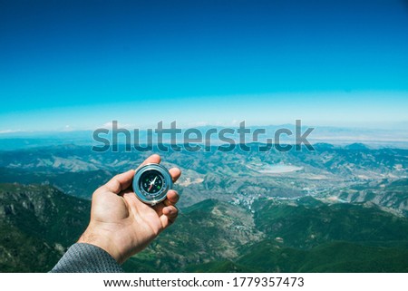 view from the top of Mount Khustup to the mountains and the compass