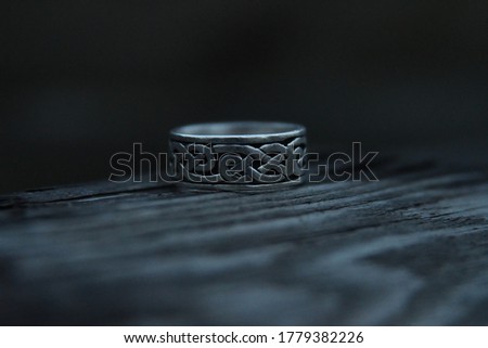 viking runes on a silver ring Royalty-Free Stock Photo #1779382226