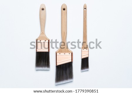 Photograph of professional grade paint brush set , 1", 2" and 2.5" brush on white background Royalty-Free Stock Photo #1779390851