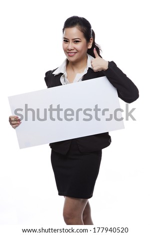 Asian businesswoman holding blank whiteboard sign - Casual business woman in suit is holding blank billboard placard and showing its empty copy-space - Isolated on white background.